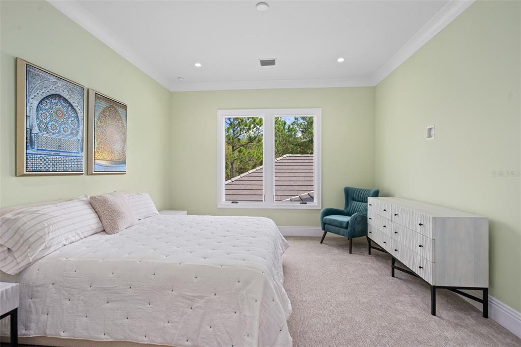 10065 Autumn Mist Lane Orlando, FL 32836 - Photo 45 of 65 a bedroom with a bed and wooden floor