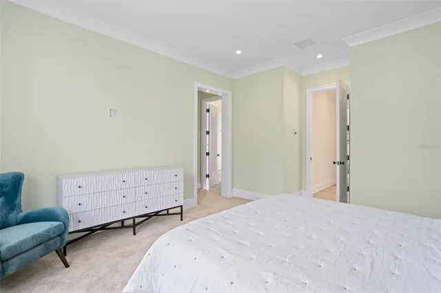 a balcony with furniture and a floor to ceiling window