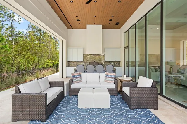 a front view of a house with a yard and outdoor seating