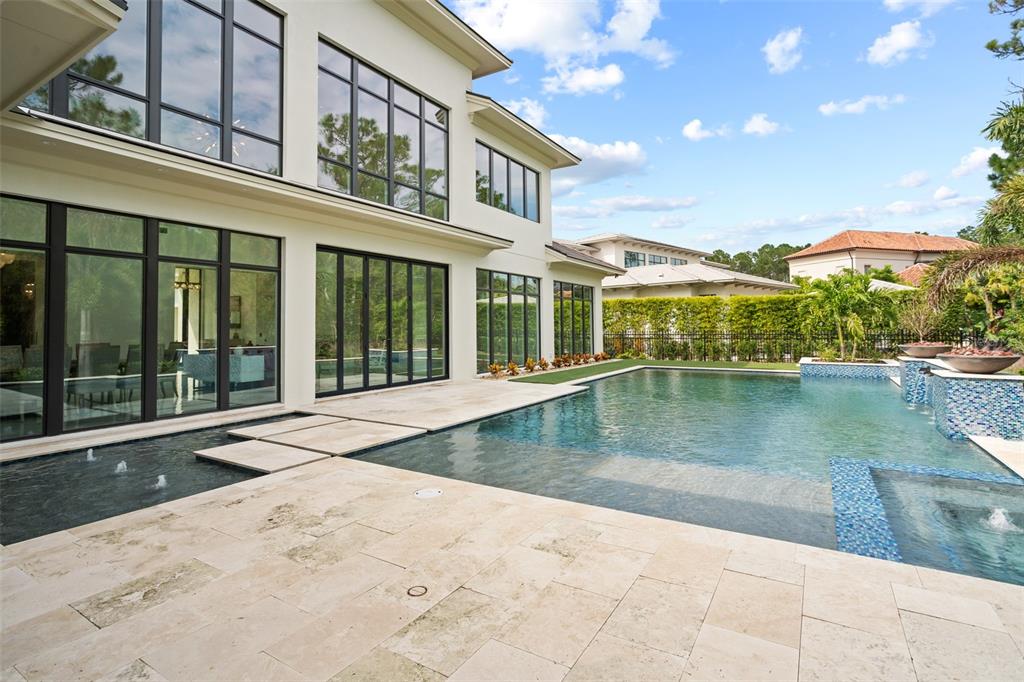 10065 Autumn Mist Lane Orlando, FL 32836 - Photo 54 of 65 a view of a house with swimming pool