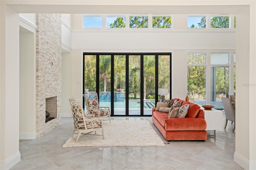 10065 Autumn Mist Lane Orlando, FL 32836 - Photo 6 of 65 a living room with furniture and a floor to ceiling window