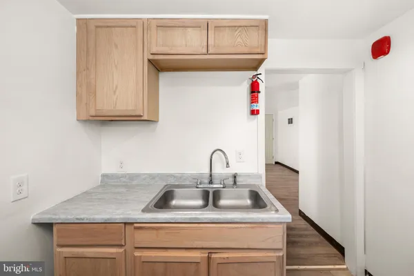a kitchen with a sink and cabinets