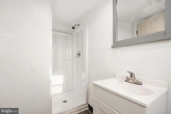 a bathroom with a sink a vanity and a mirror