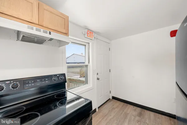 a view of kitchen with wooden floor