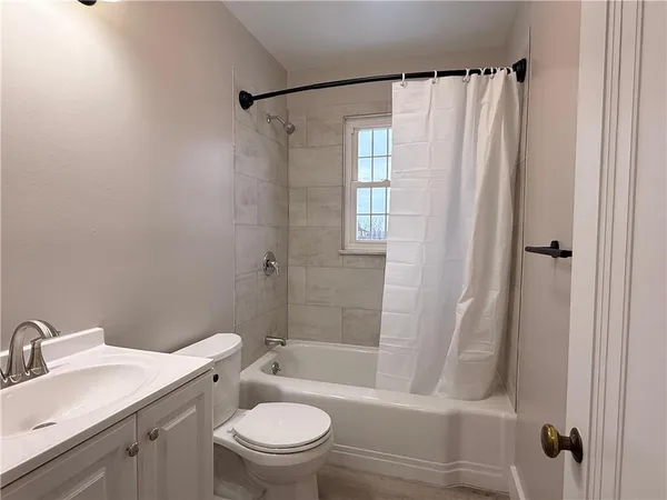 a bathroom with a toilet and a sink