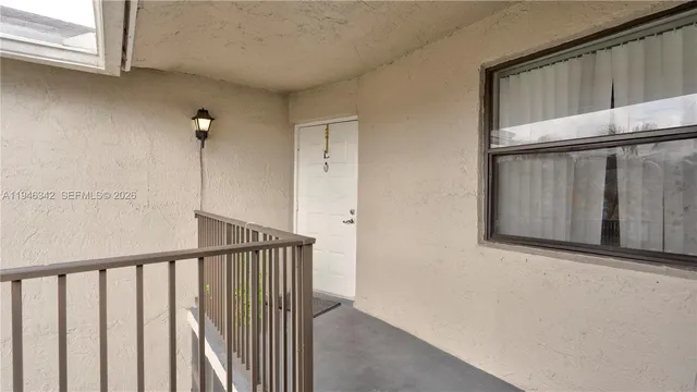 a view of staircase with window