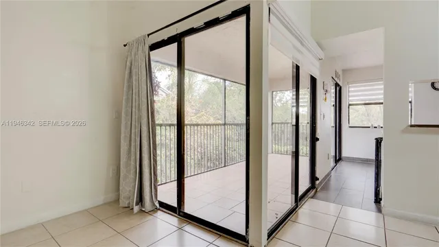 a view of an entryway with a floor to ceiling window