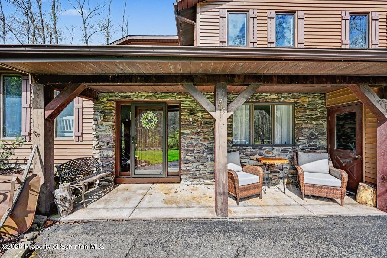 719 Scott Road Clarks Summit, PA 18411 - Photo 50 of 51 a view of front door of house with outdoor seating