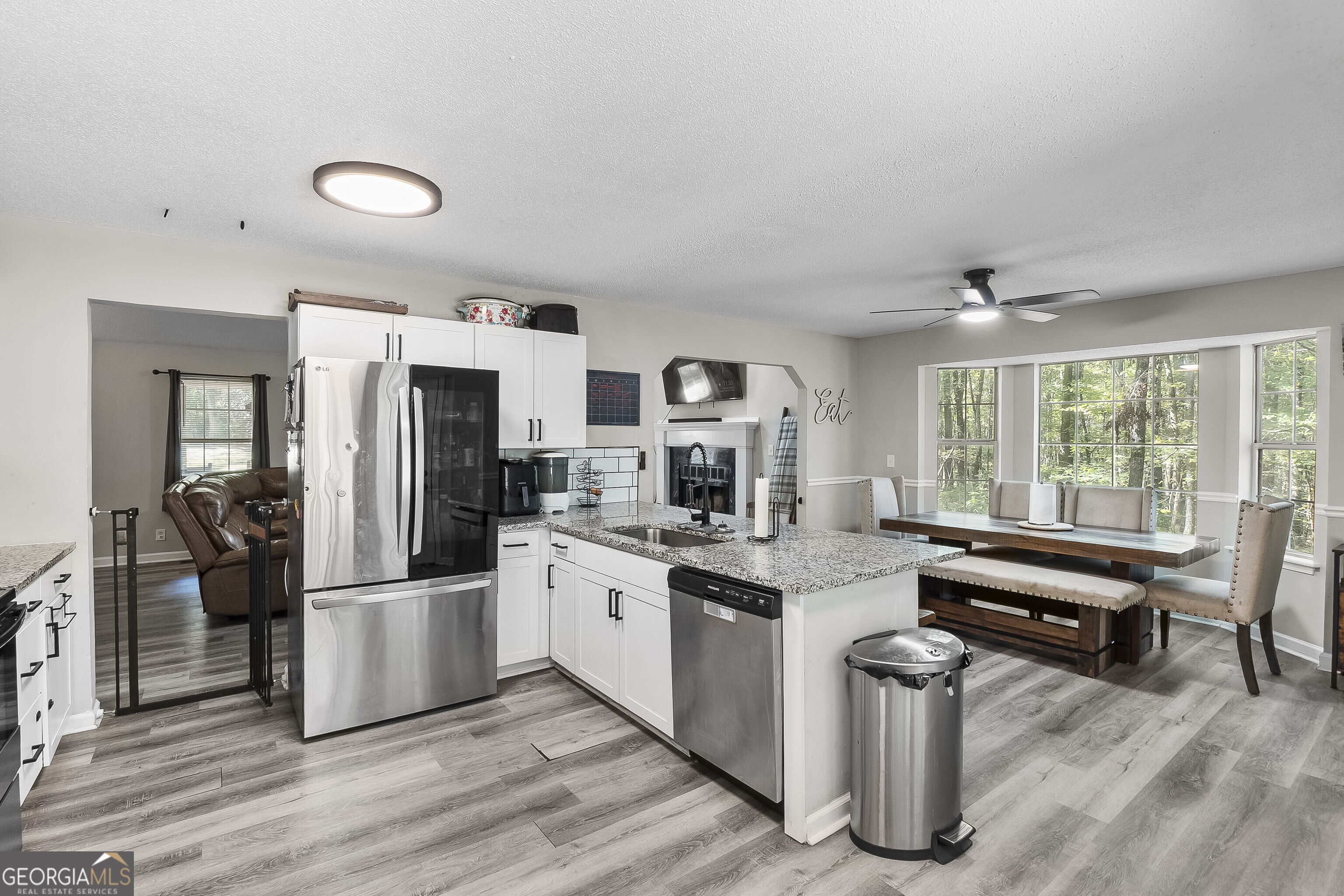 1412 Johnson Road Macon, GA 31220 - Photo 25 of 53 a kitchen with stainless steel appliances granite countertop a refrigerator and a stove top oven