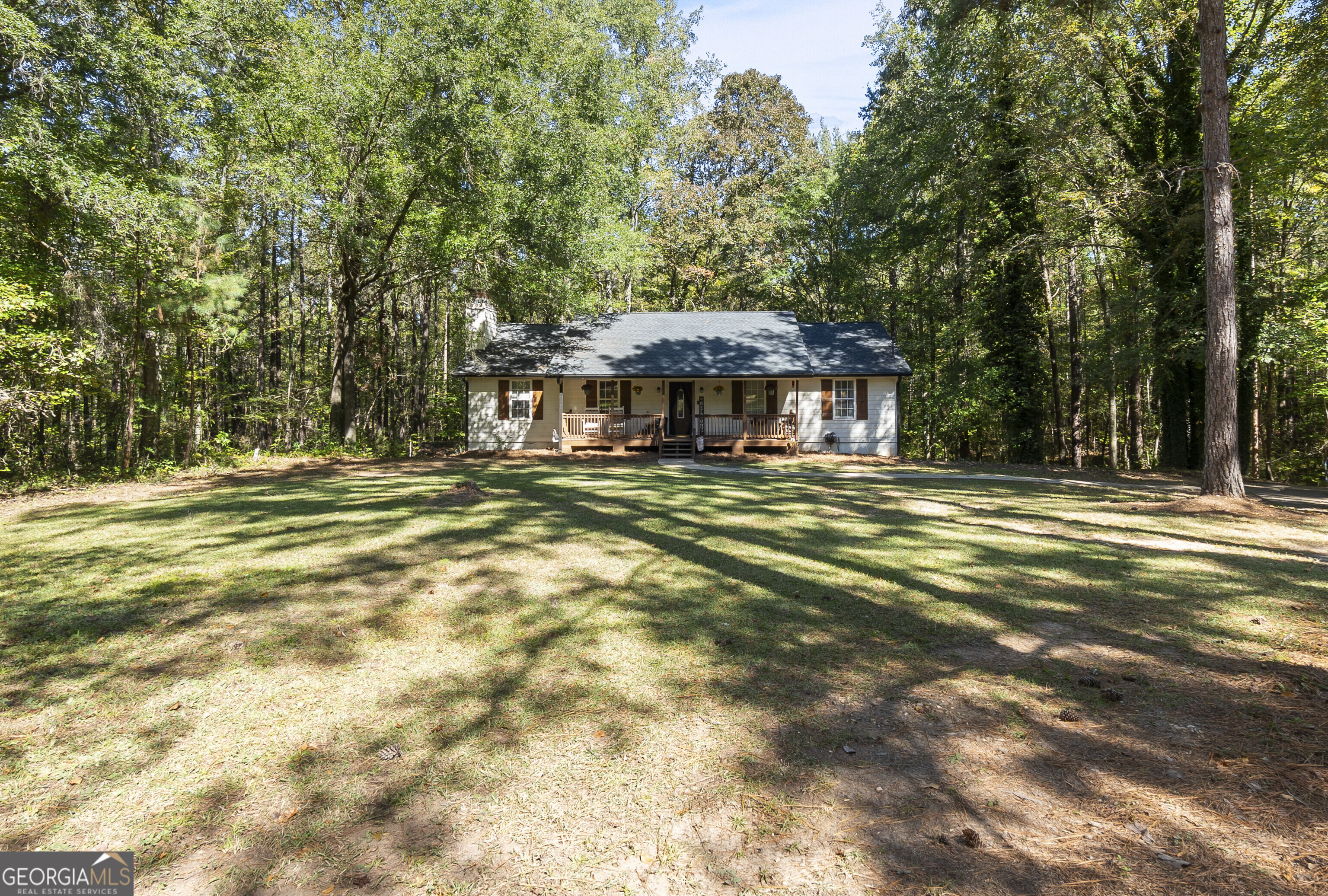 1412 Johnson Road Macon, GA 31220 - Photo 3 of 53 a house with swimming pool in front of it