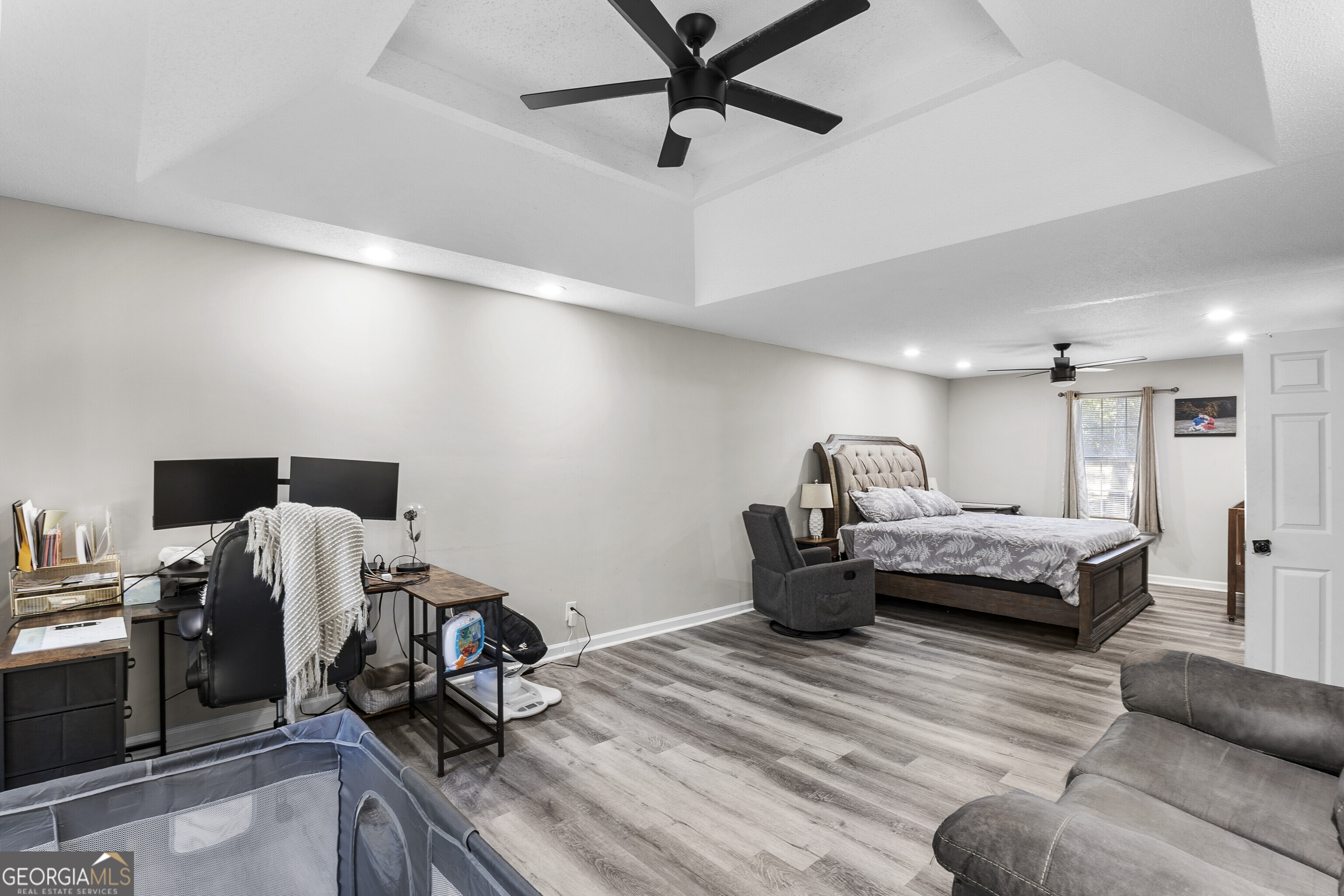 1412 Johnson Road Macon, GA 31220 - Photo 32 of 53 a bedroom with a bed and wooden floor