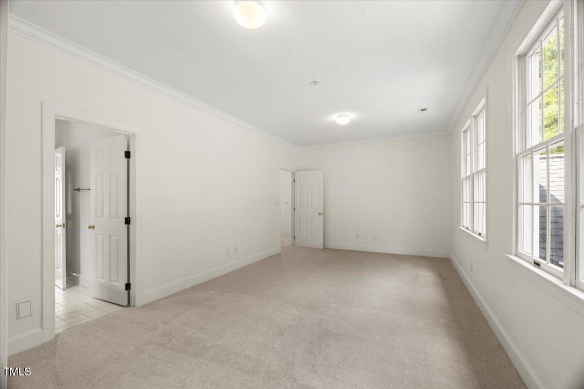 4016 Edward Pride Wynd Raleigh, NC 27612 - Photo 42 of 69 a view of an empty room with a window