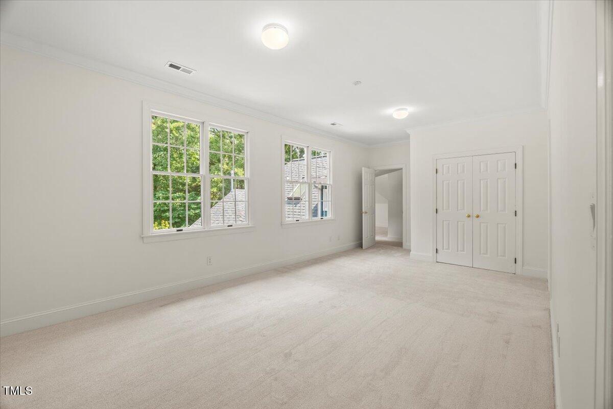 4016 Edward Pride Wynd Raleigh, NC 27612 - Photo 43 of 69 an empty room with windows