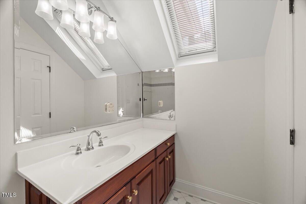 4016 Edward Pride Wynd Raleigh, NC 27612 - Photo 50 of 69 a bathroom with a sink and a mirror