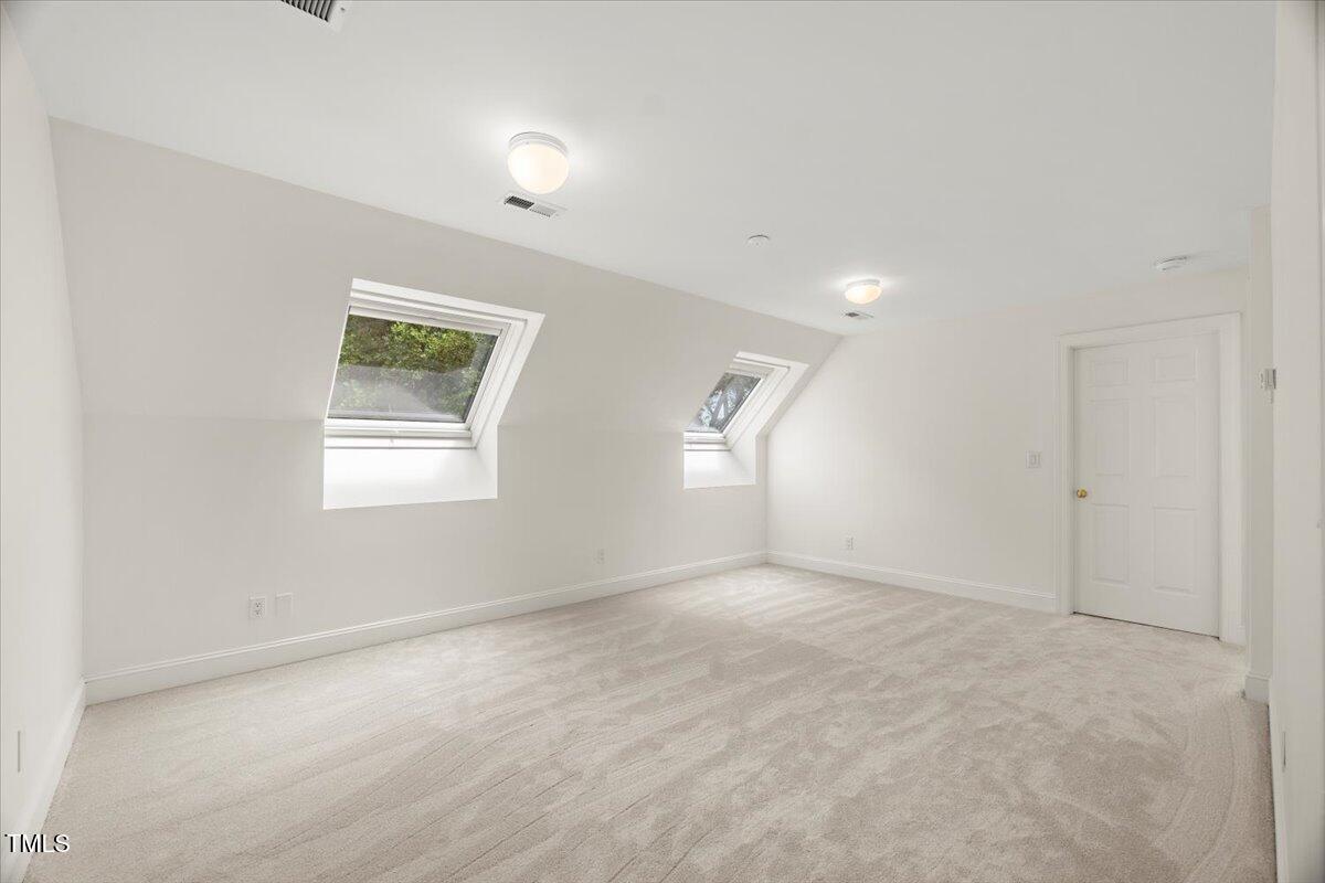 4016 Edward Pride Wynd Raleigh, NC 27612 - Photo 57 of 69 an empty room with windows