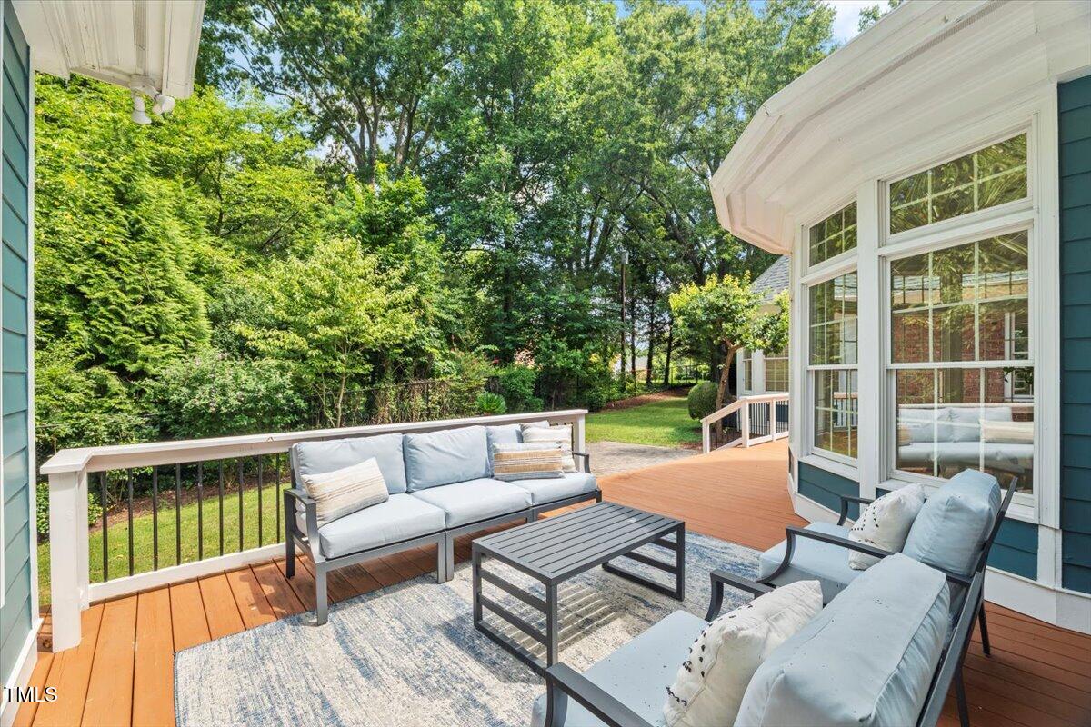 4016 Edward Pride Wynd Raleigh, NC 27612 - Photo 59 of 69 a view of a patio with couches table and chairs and potted plants