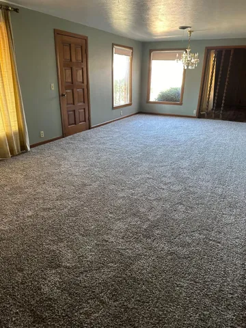 a view of an empty room and window