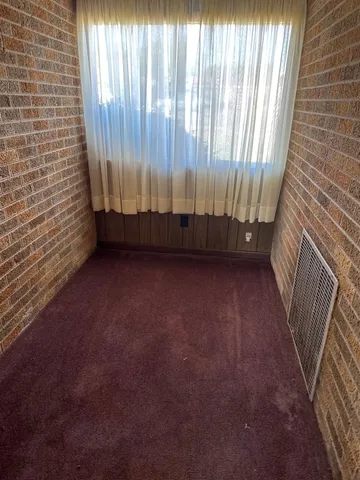 a view of a back yard from a balcony