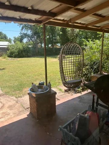 a view of a swimming pool with a patio