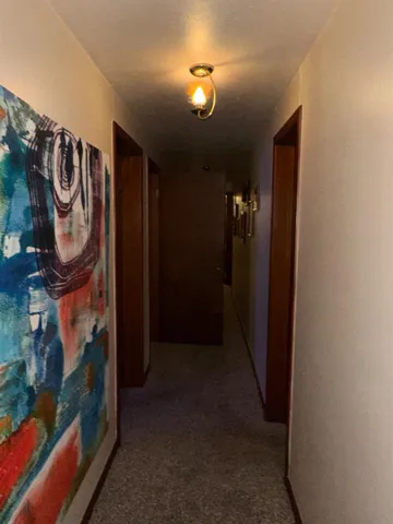 a view of a hallway with washer and dryer