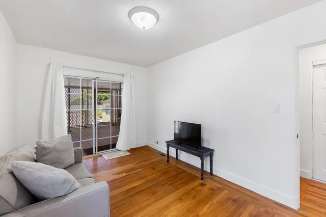 a living room with a couch and a flat screen tv