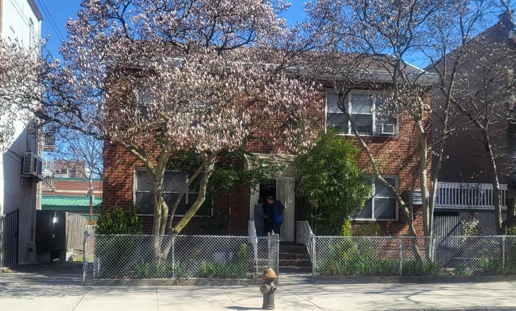 a front view of a house with tree s