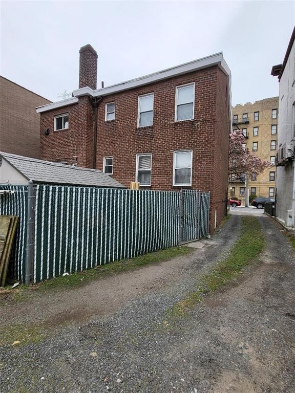 609 Ovington Avenue Brooklyn, NY 11209 - Photo 10 of 11 a view of a brick house with many windows