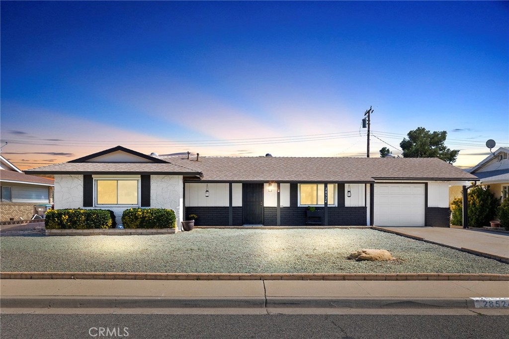 28524 East Worcester Road Menifee, CA 92586 - Photo 1 of 1 a front view of a house with a yard
