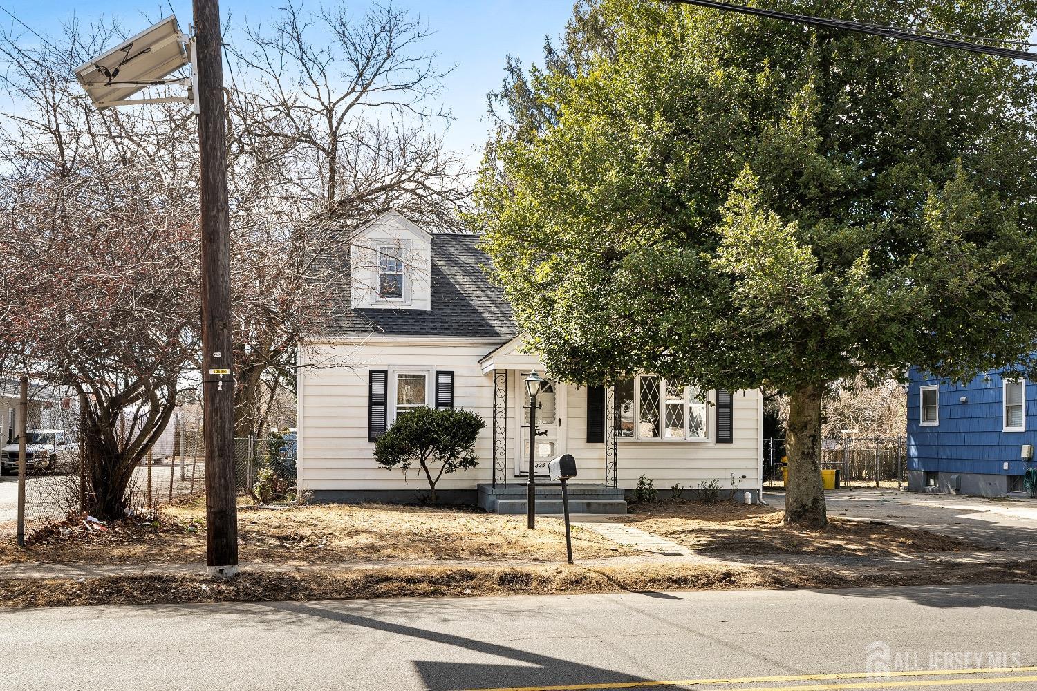 225 Kuser Road Hamilton, NJ 08619 - Photo 1 of 26 a front view of a house with a yard
