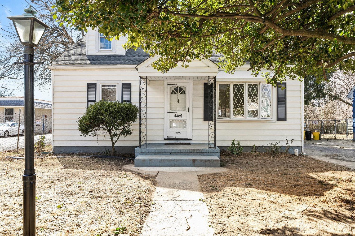 225 Kuser Road Hamilton, NJ 08619 - Photo 2 of 26 a front view of a house with garden