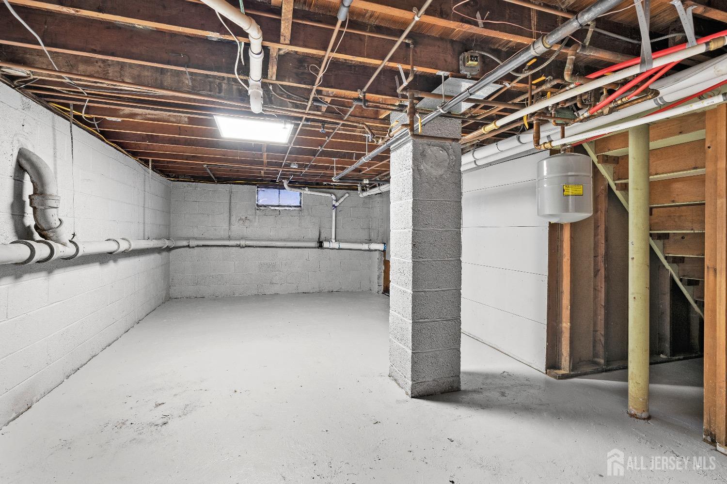 225 Kuser Road Hamilton, NJ 08619 - Photo 23 of 26 a view of an empty room with racks on the wall