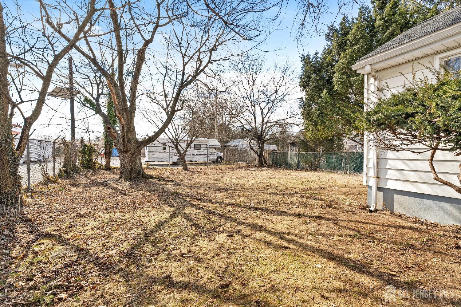 225 Kuser Road Hamilton, NJ 08619 - Photo 25 of 26 a view of a yard covered in snow