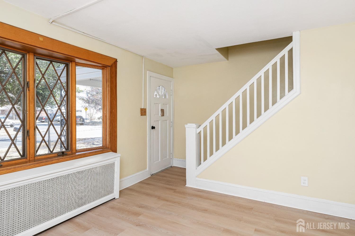 225 Kuser Road Hamilton, NJ 08619 - Photo 5 of 26 a view of an entryway with wooden floor and windows