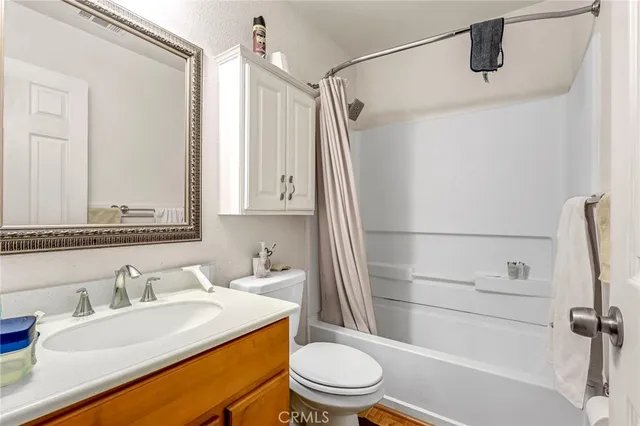 a bedroom with a bed and a flat tv screen