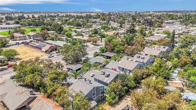 an aerial view of a house with a yard