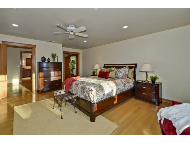 240 Gillette Road Aptos, CA 95003 - Photo 12 of 24 a bedroom with a bed and wooden floor