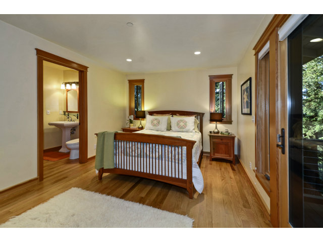 240 Gillette Road Aptos, CA 95003 - Photo 17 of 24 a bedroom with a bed and wooden floor