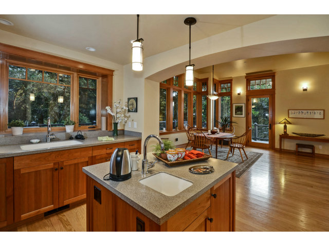 240 Gillette Road Aptos, CA 95003 - Photo 8 of 24 a kitchen with a table chairs and a wooden floor