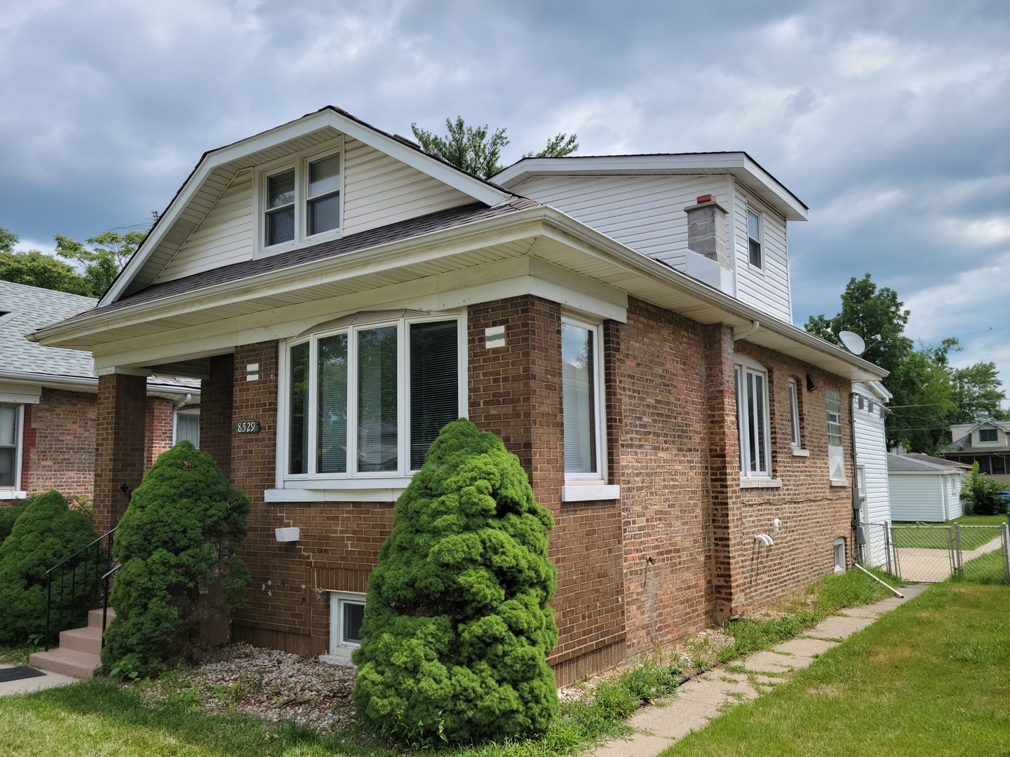 front view of a house with a yard