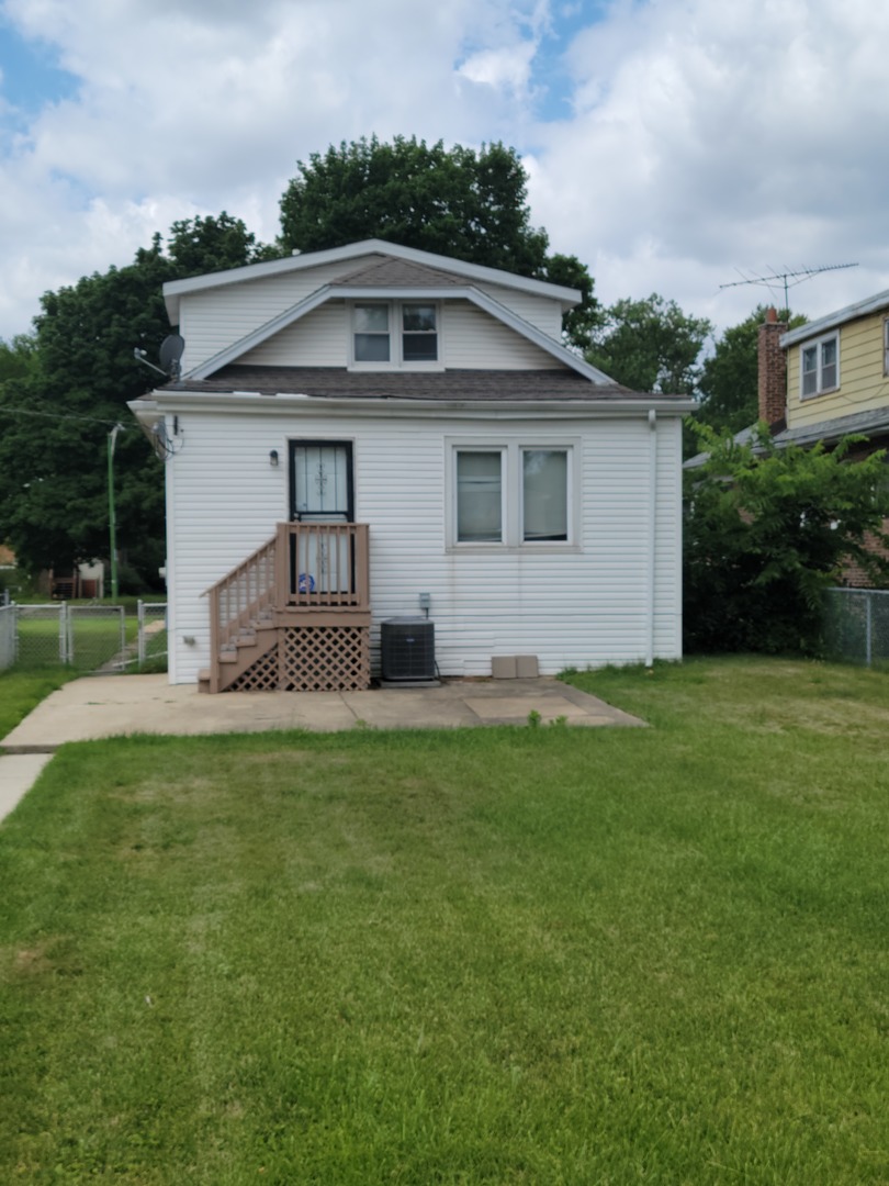 8529 South Rhodes Avenue Chicago, IL 60619 - Photo 13 of 16 a front view of house with yard