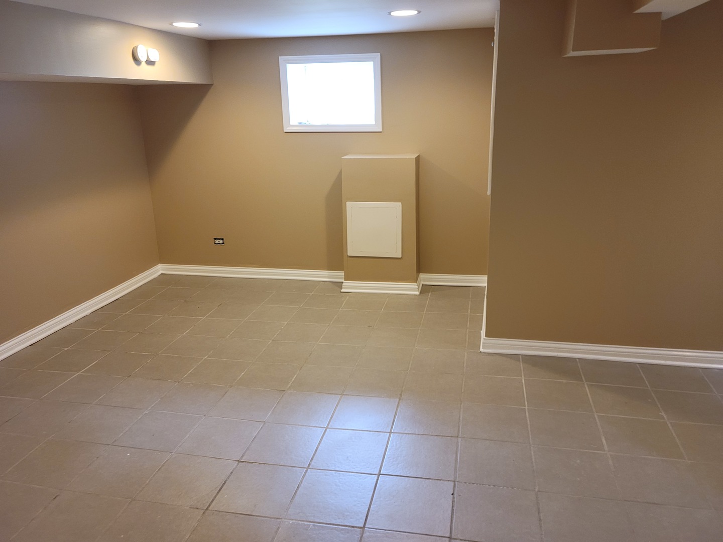 8529 South Rhodes Avenue Chicago, IL 60619 - Photo 9 of 16 a view of an empty room with a window