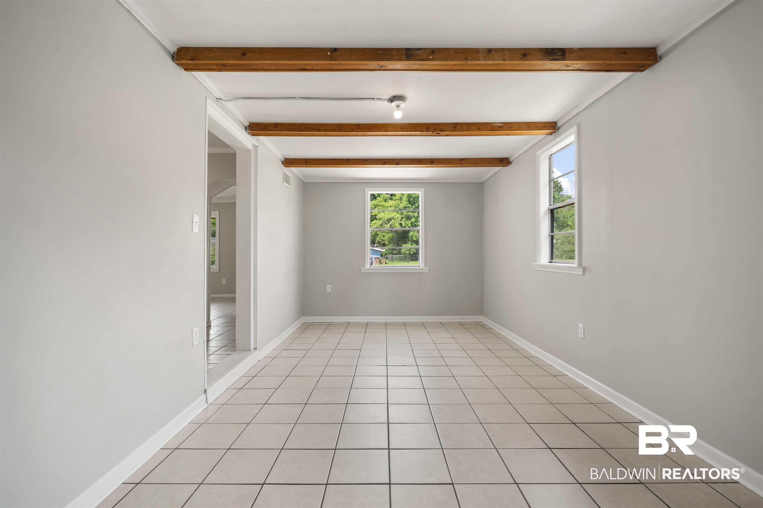 963 Shady Brook Drive Mobile, AL 36606 - Photo 10 of 20 Unfurnished room featuring beamed ceiling and baseboards