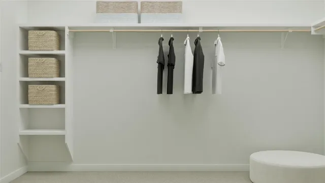 a bedroom with furniture and a large window