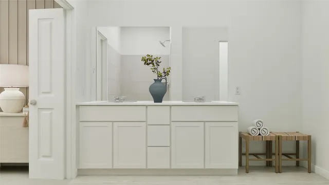 a bathroom with a shower and a glass door