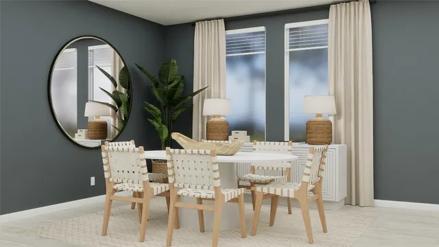 a dining room with furniture a kitchen view and wooden floor