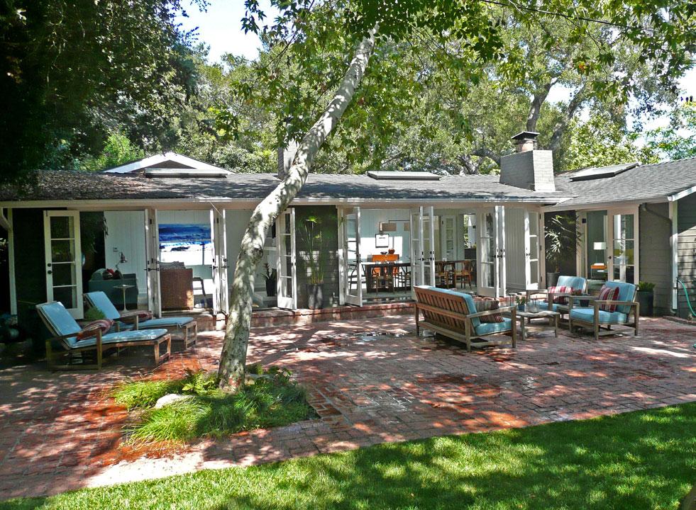 2860 East Valley Road Montecito, CA 93108 - Photo 12 of 14 a view of a table and chairs in backyard of the house