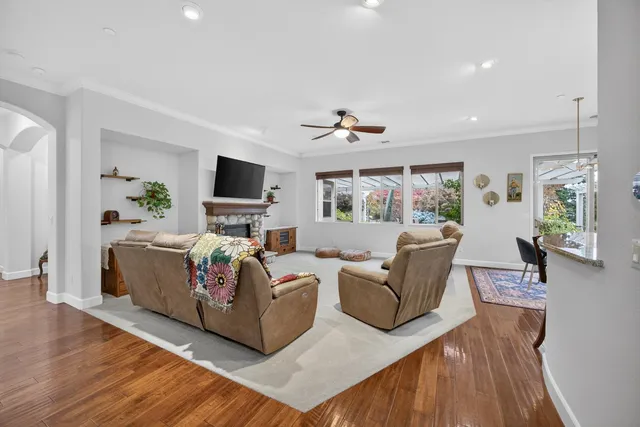 a kitchen with granite countertop stainless steel appliances and wooden cabinets