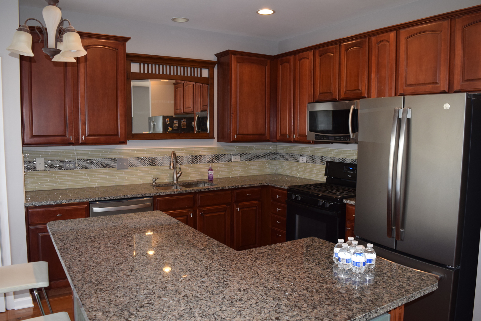 4110 Bethlehem Road Aurora, IL 60504 - Photo 18 of 53 a kitchen with stainless steel appliances granite countertop a refrigerator sink and cabinets