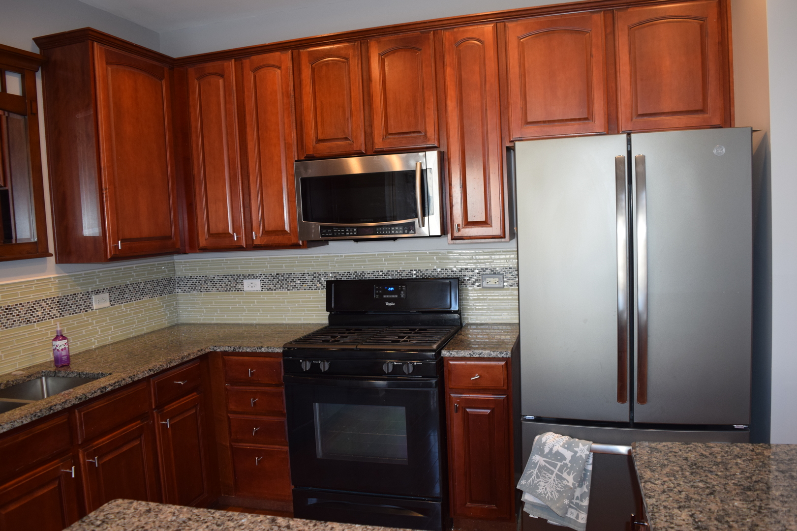 4110 Bethlehem Road Aurora, IL 60504 - Photo 21 of 53 a kitchen with stainless steel appliances granite countertop a refrigerator stove top oven