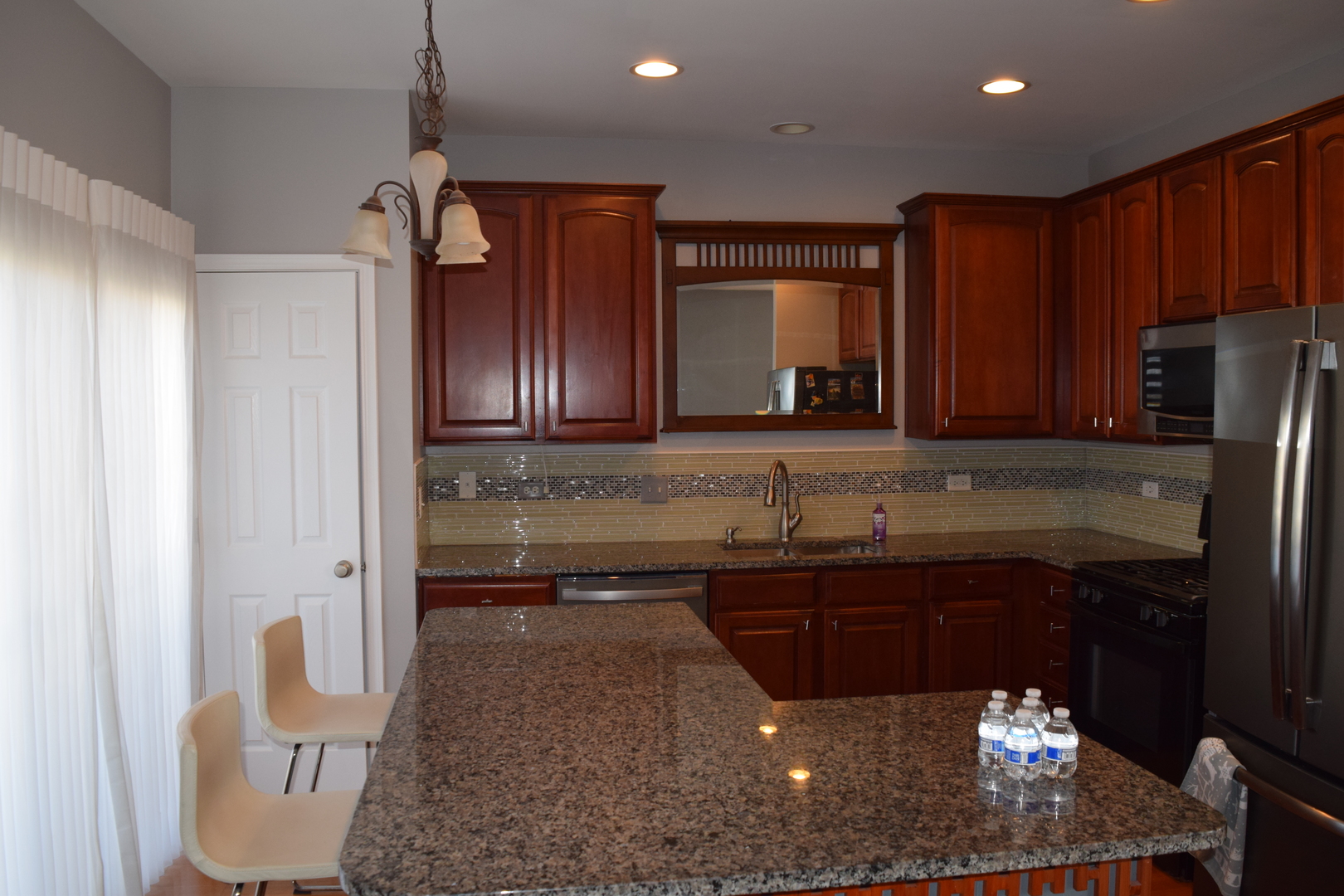 4110 Bethlehem Road Aurora, IL 60504 - Photo 23 of 53 a kitchen with a sink and a refrigerator